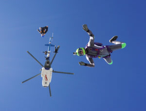 A skydiver in a grey suit