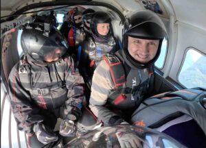 A group of skydivers ready to jump