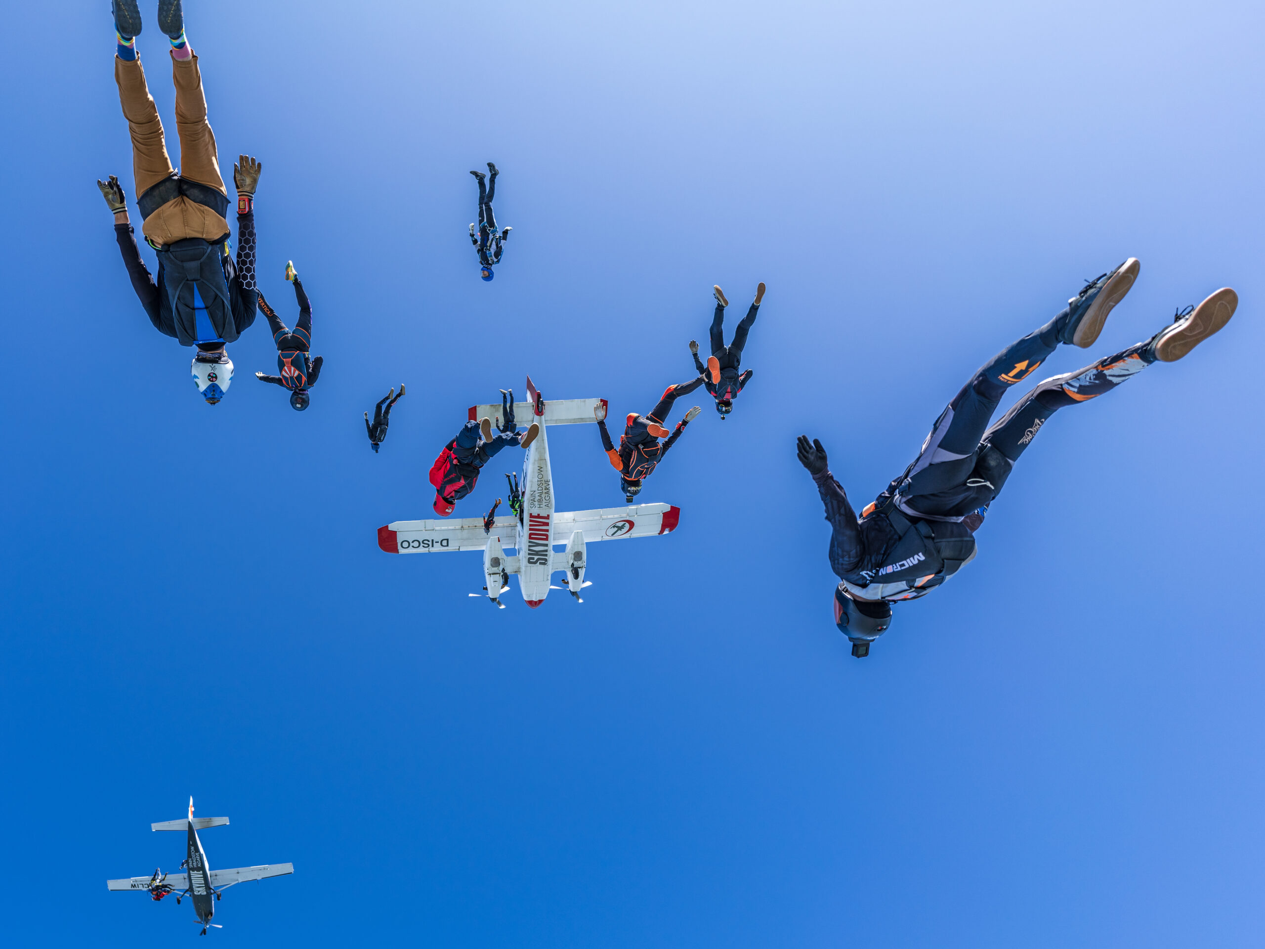 A group of skydivers photographed mid-fall