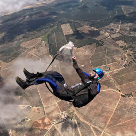 Skydiver preparing to release parachute