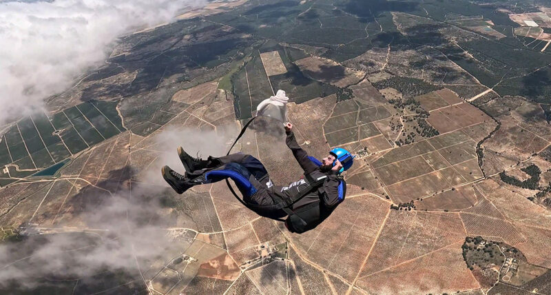 Skydiver preparing to release parachute