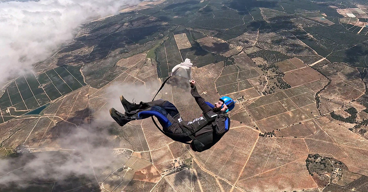 Skydiver preparing to release parachute