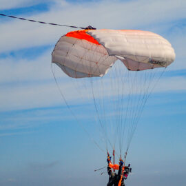 Skydiver gliding with an open canopy