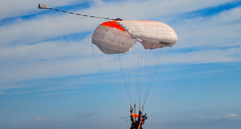 Skydiver gliding with an open canopy