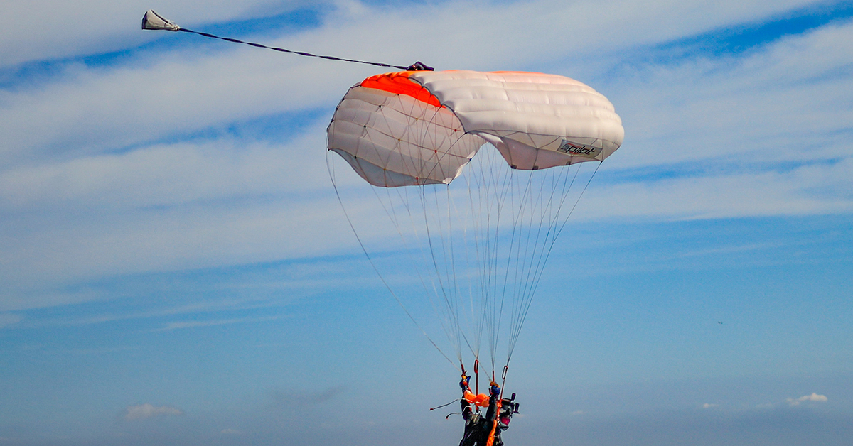 Skydiver gliding with an open canopy