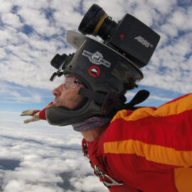Andy Ford mid-skydive, with a camera set-up on his helmet