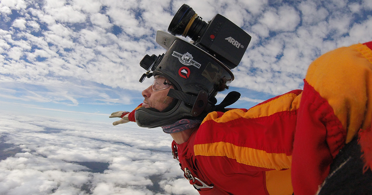 Andy Ford mid-skydive, with a camera set-up on his helmet