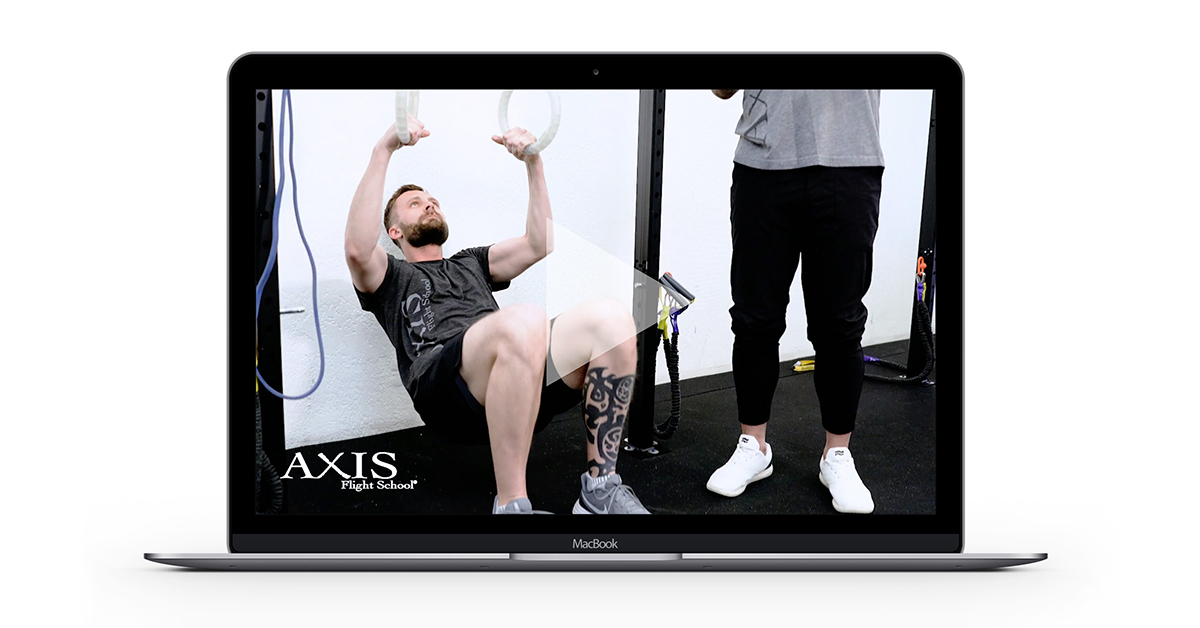 Laptop open on a fitness video.